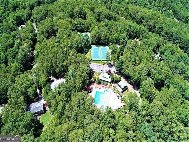 aerial view featuring a wooded view