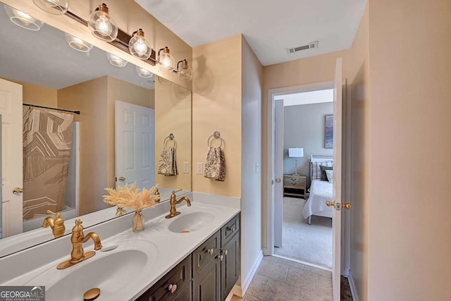 bathroom with double vanity, visible vents, a sink, and a shower with shower curtain