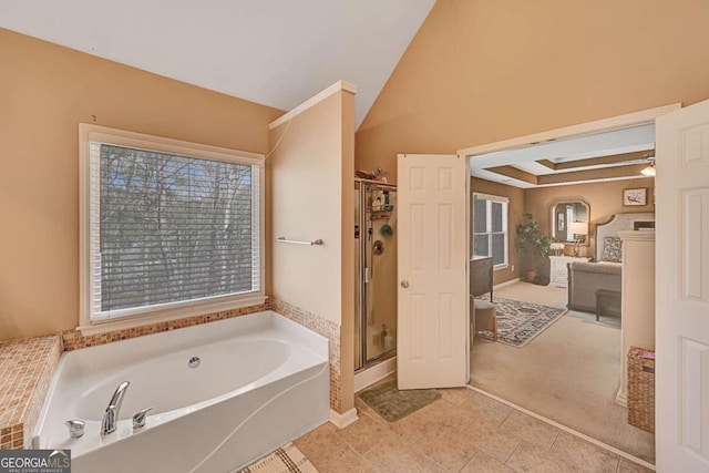 bathroom featuring a garden tub, lofted ceiling, a stall shower, vanity, and tile patterned flooring