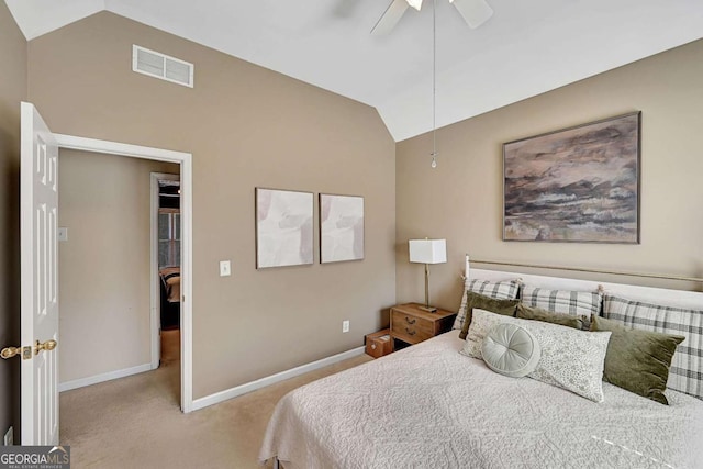 carpeted bedroom featuring lofted ceiling, a ceiling fan, visible vents, and baseboards