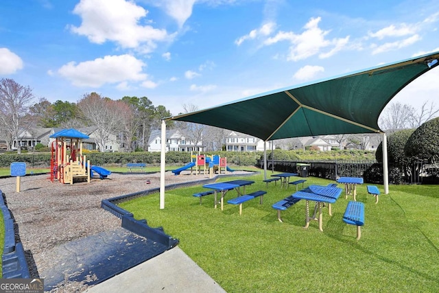 community playground featuring a lawn