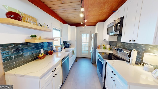 kitchen featuring open shelves, tasteful backsplash, appliances with stainless steel finishes, wood ceiling, and white cabinets