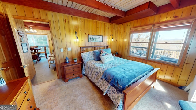 bedroom featuring a chandelier, wooden ceiling, wooden walls, light carpet, and beamed ceiling