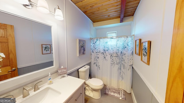 bathroom with beam ceiling, toilet, vanity, wooden ceiling, and tile patterned floors