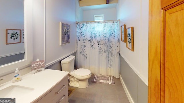 bathroom with toilet, tile patterned flooring, vanity, and a shower with curtain