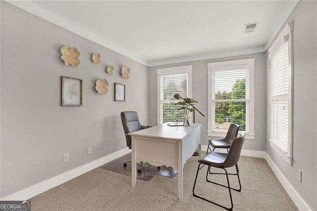 office featuring visible vents, baseboards, and light colored carpet