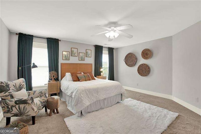 bedroom with carpet flooring, ceiling fan, and baseboards