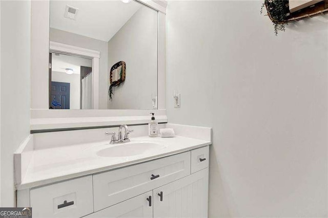 bathroom with visible vents and vanity