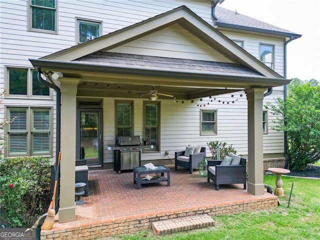 rear view of house with a patio area, ceiling fan, and an outdoor living space