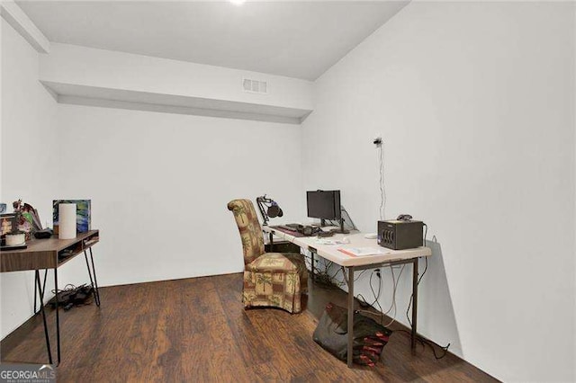 office space with wood finished floors and visible vents