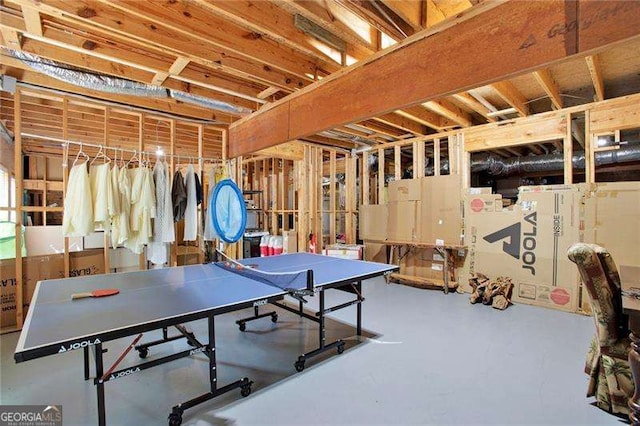 game room featuring finished concrete floors