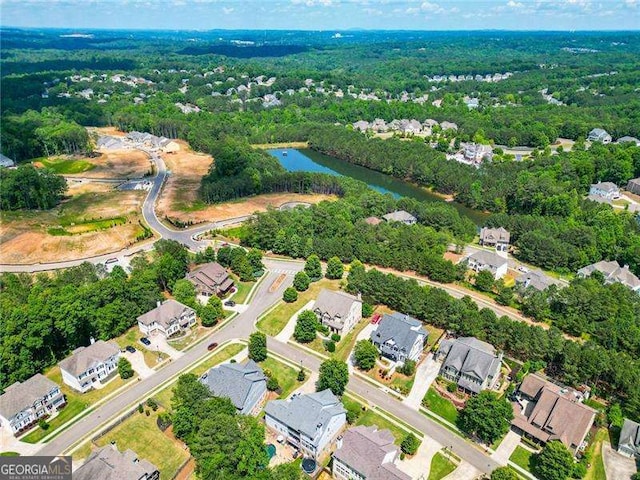 bird's eye view featuring a residential view, a water view, and a view of trees