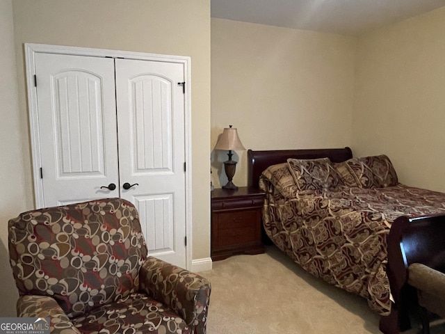 bedroom with a closet and carpet flooring