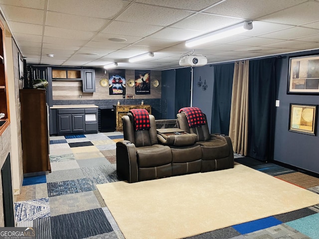 home theater room featuring a paneled ceiling