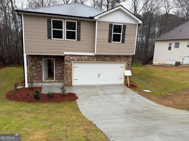 view of front facade with a garage, brick siding, driveway, and a front lawn