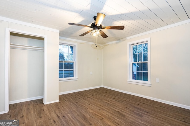 unfurnished bedroom with ceiling fan, a closet, baseboards, and wood finished floors