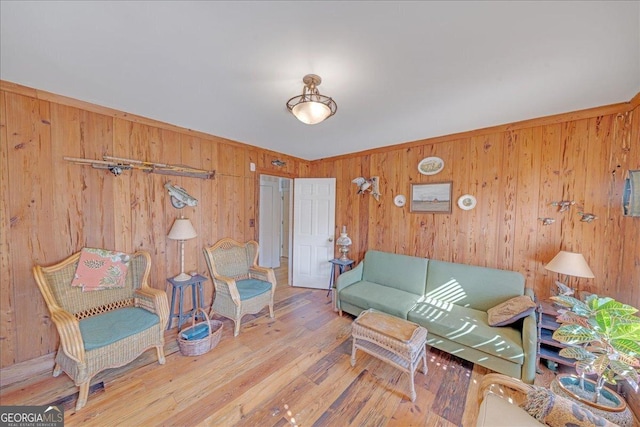 living room featuring wooden walls and wood finished floors