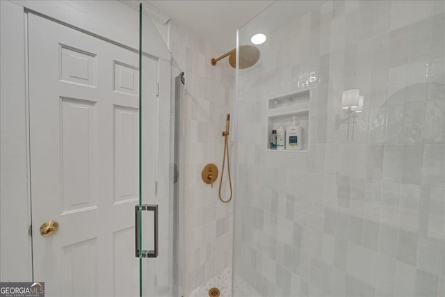 bathroom with a shower stall