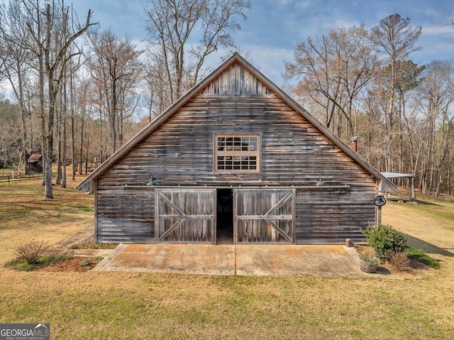 view of barn with a lawn