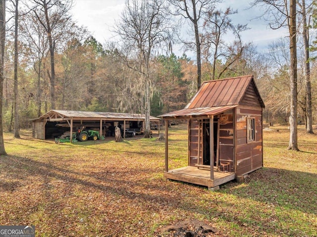 view of shed with a forest view