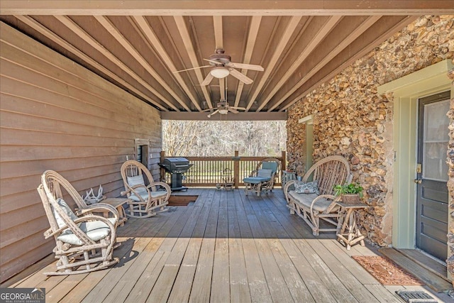 wooden deck with a ceiling fan, visible vents, and a grill