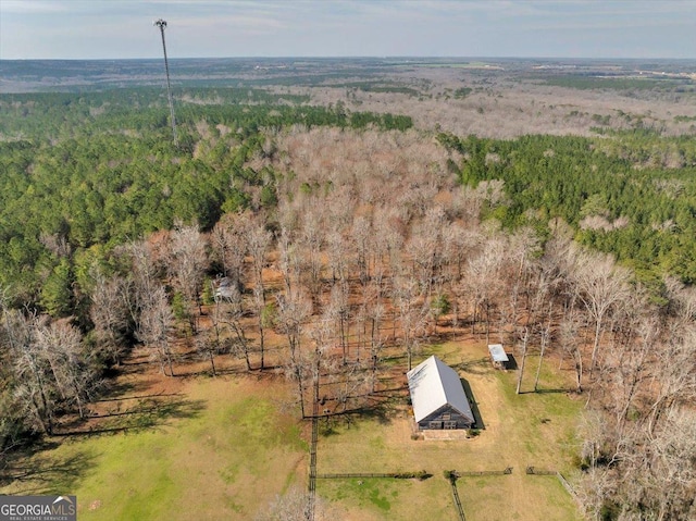 aerial view featuring a wooded view