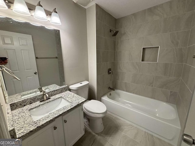 bathroom featuring toilet, washtub / shower combination, and vanity