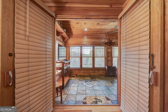 interior space featuring wooden ceiling and vaulted ceiling