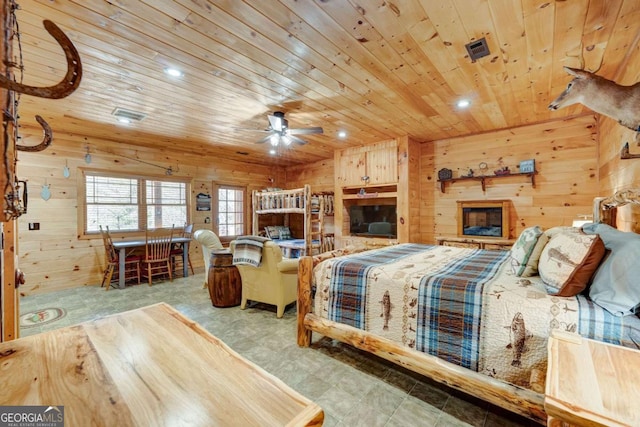 bedroom featuring visible vents, wood walls, wood ceiling, and recessed lighting