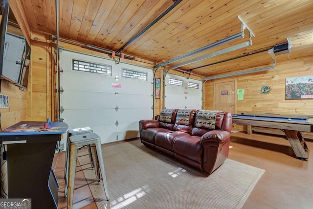 garage featuring wood ceiling and wood walls