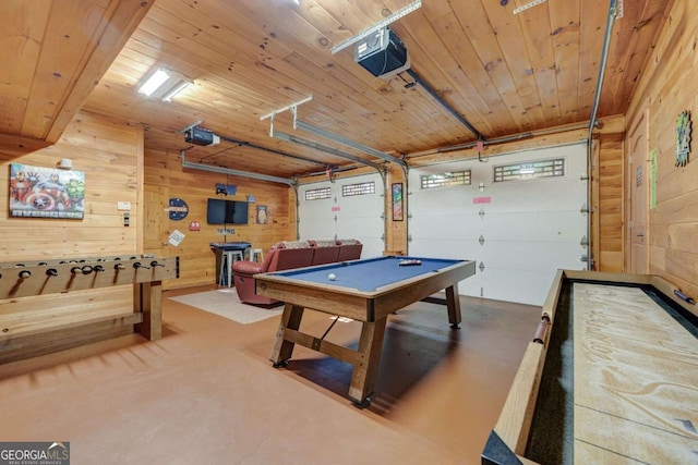 recreation room with a garage, pool table, wood ceiling, and wooden walls