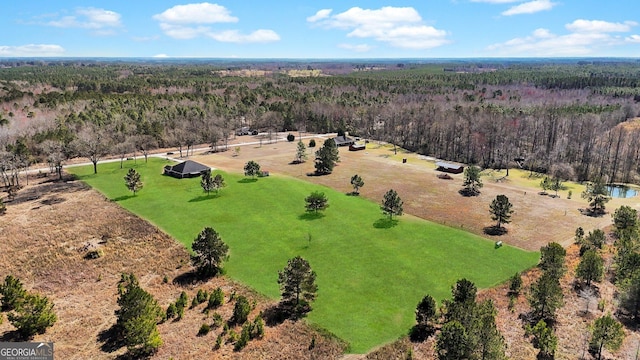 bird's eye view featuring a forest view and a rural view