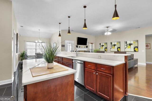 kitchen featuring a kitchen island, a sink, open floor plan, dark brown cabinets, and dishwasher