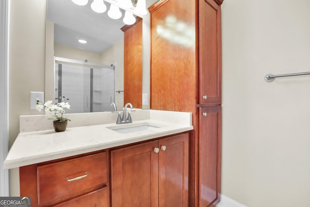 full bathroom featuring a shower stall and vanity