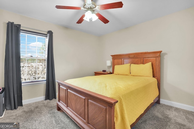 bedroom with baseboards, ceiling fan, and light colored carpet