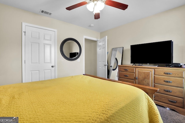 bedroom with ceiling fan and visible vents