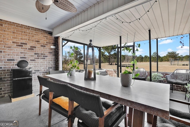 view of patio with ceiling fan and outdoor wet bar