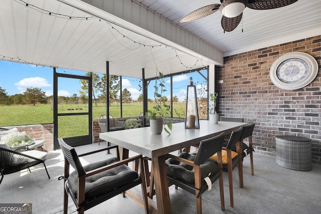 sunroom / solarium with ceiling fan