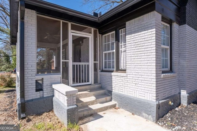 property entrance with brick siding