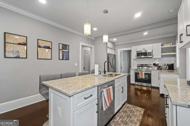 kitchen with decorative backsplash, dark wood-style floors, appliances with stainless steel finishes, open shelves, and a sink