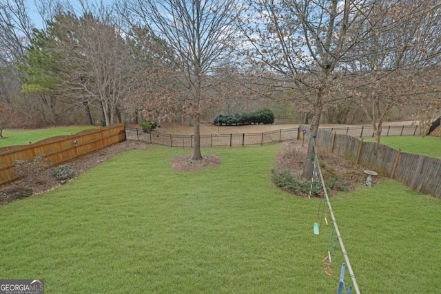 view of yard with a fenced backyard