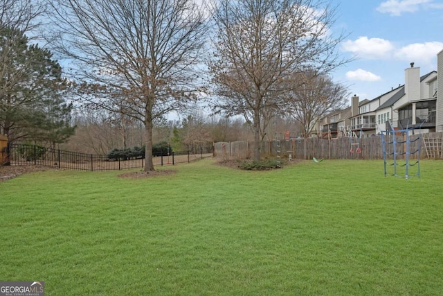 view of yard with fence and a residential view