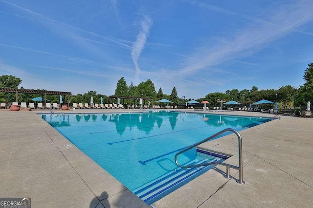 community pool featuring a patio area and a pergola