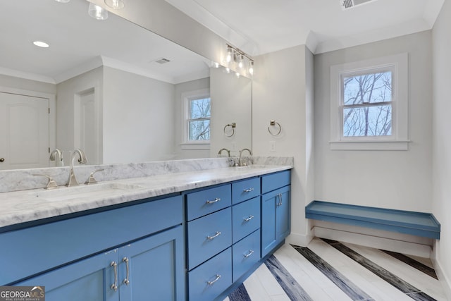 full bathroom with ornamental molding, visible vents, a sink, and double vanity