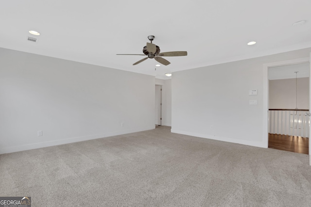 unfurnished room featuring ceiling fan, recessed lighting, carpet flooring, visible vents, and baseboards