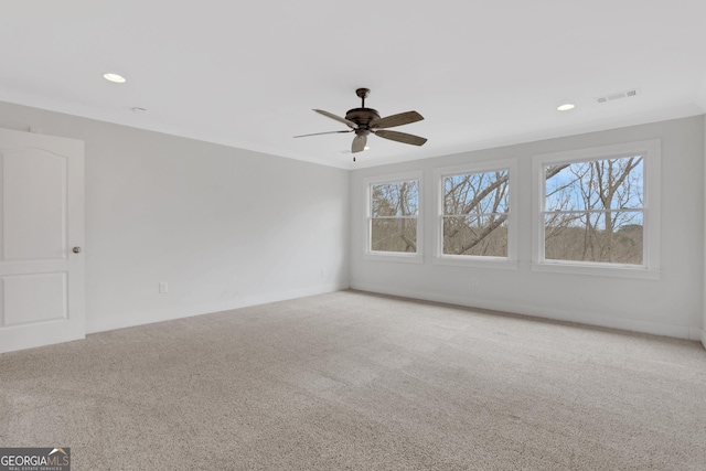 empty room featuring ceiling fan, carpet, visible vents, and recessed lighting