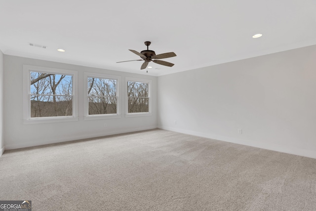 carpeted spare room featuring baseboards, visible vents, a ceiling fan, and recessed lighting