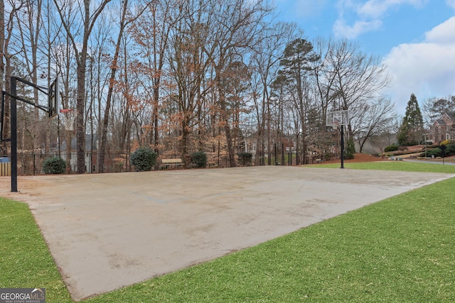 view of sport court featuring community basketball court and a lawn