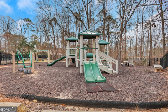 communal playground featuring fence