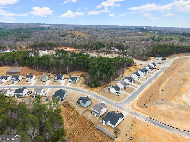 bird's eye view featuring a forest view